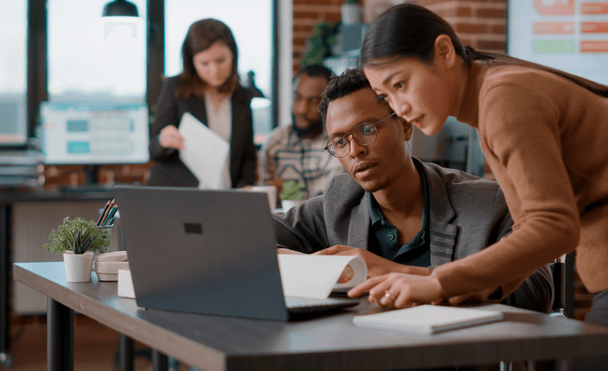Man and women looking at laptop.png